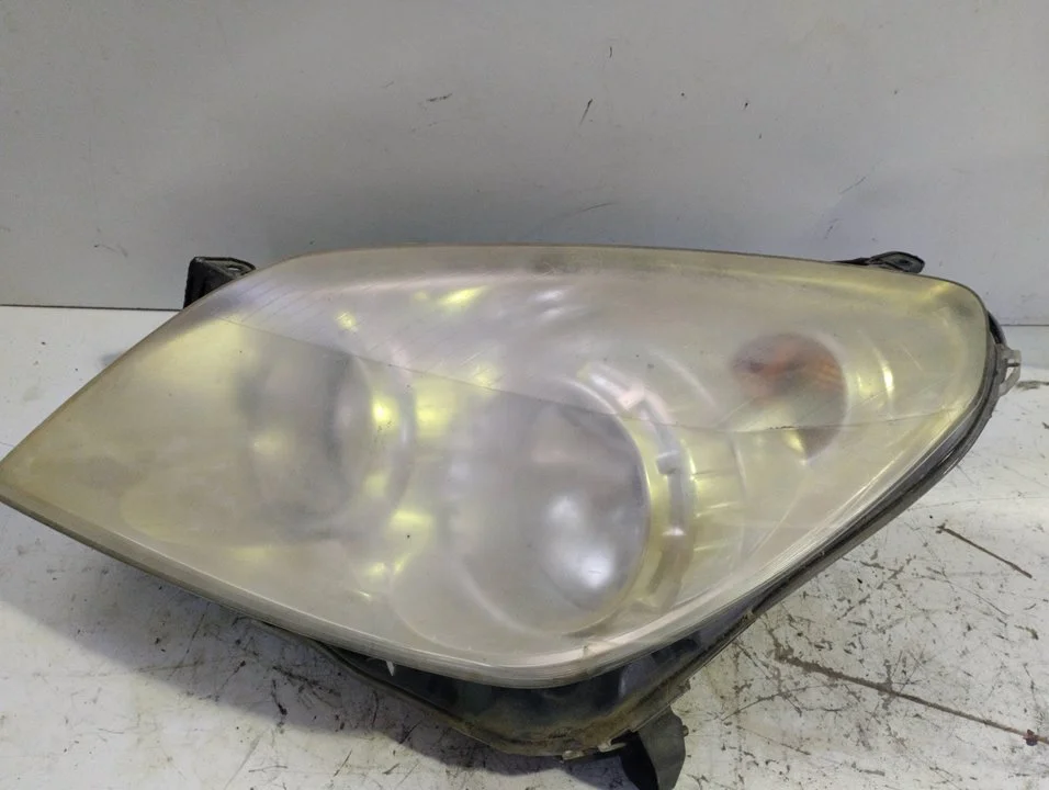 Foto de FARO IZQUIERDO OPEL ASTRA H BERLINA referencia 1EG27037041