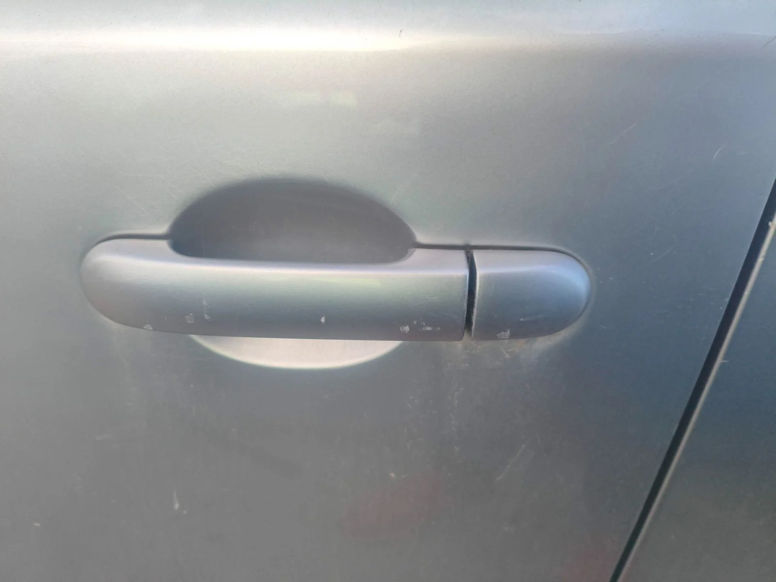 Foto de MANETA EXTERIOR DELANTERA IZQUIERDA NISSAN NOTE (E11E) 1.4 CAT (88 CV / 65 KW) referencia 80640AX62B
