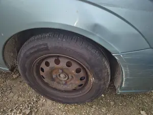 Foto de PASO RUEDA TRASERO DERECHO FORD FOCUS FAMILIAR (CAK) 1.8 TDDI Turbodiesel CAT (90 CV / 66 KW)