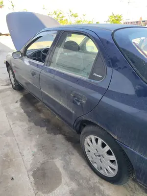 Foto de PUERTA TRASERA IZQUIERDA FORD MONDEO BERLINA (GD) 1.8 Turbodiesel CAT (90 CV / 66 KW) referencia 1043425 foto 2